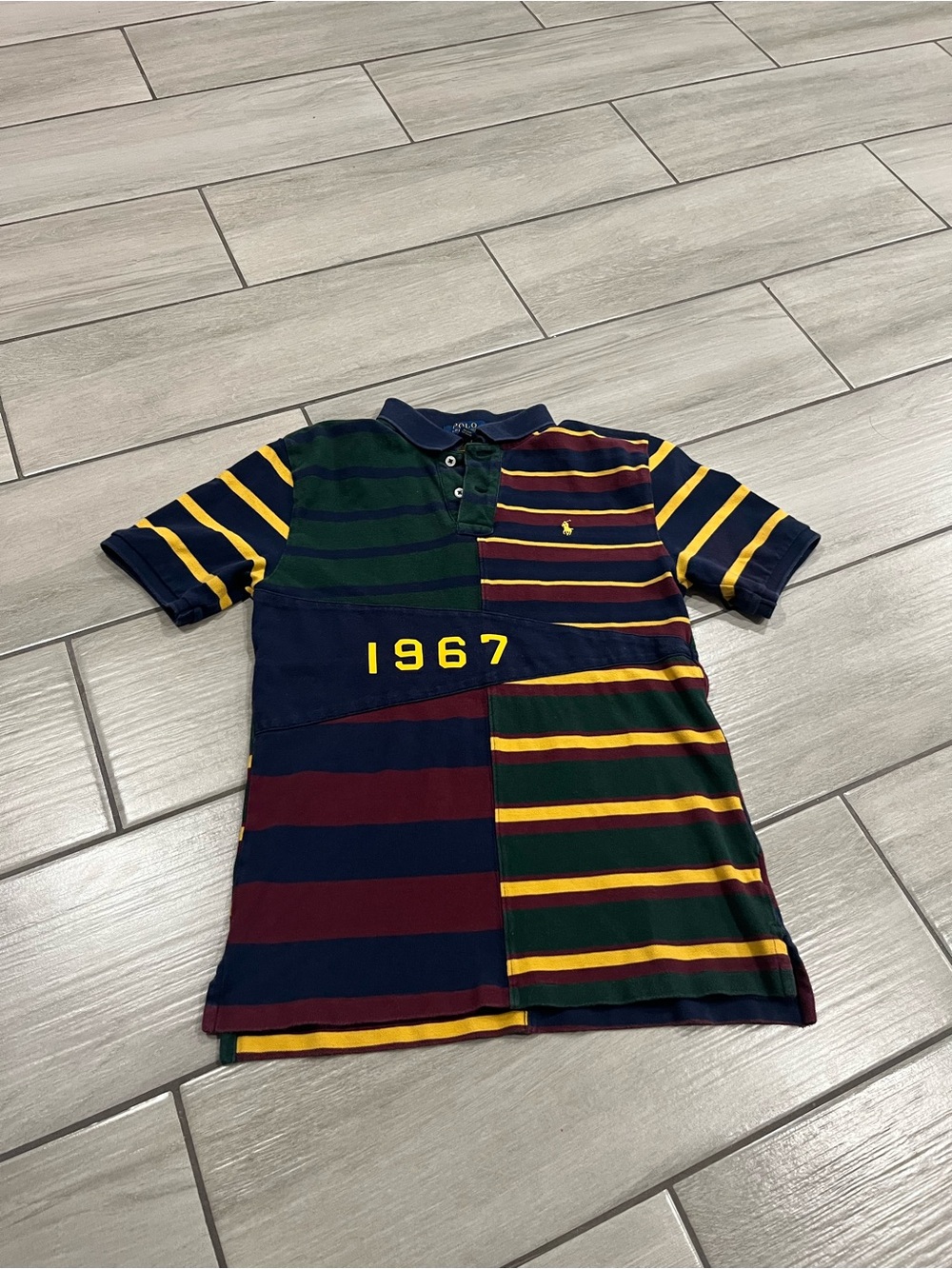 #5. Polo by Ralph Lauren Multi-Striped Polo Shirt in Navy, Green, Yellow, Maroon